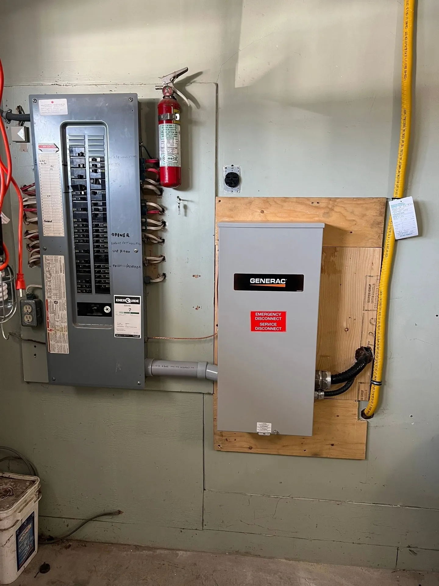 Electrical panel and adjacent equipment in a residential utility area.